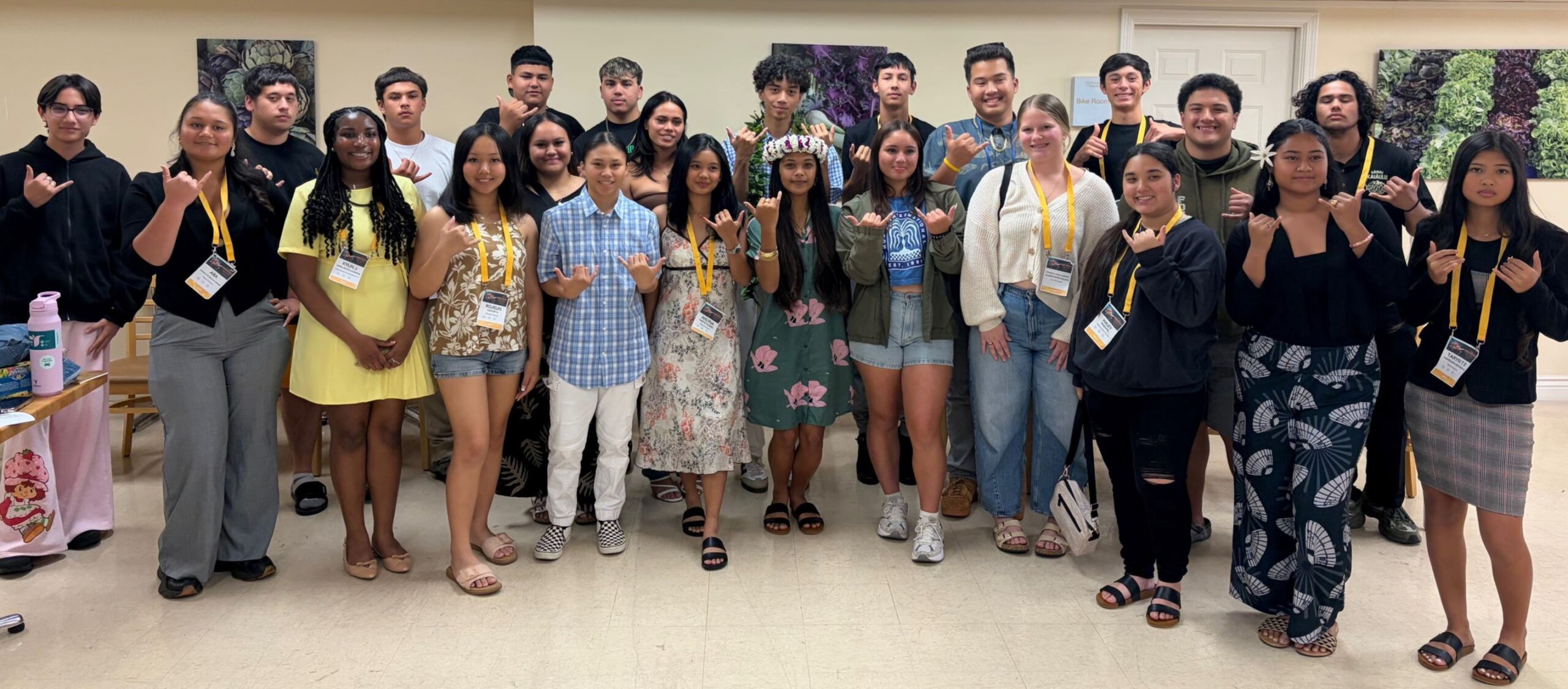 A group of Indigenous youth standing together in a classroom